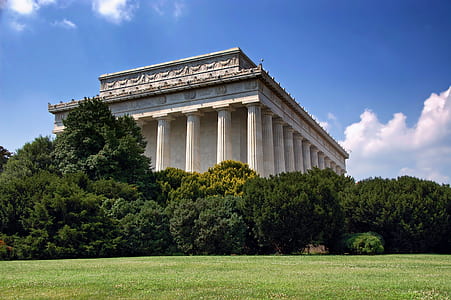 marble columns can be seen through trees thumbnail
