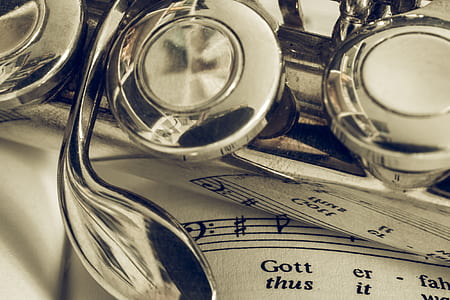 stainless steel wind instrument on white musical note thumbnail