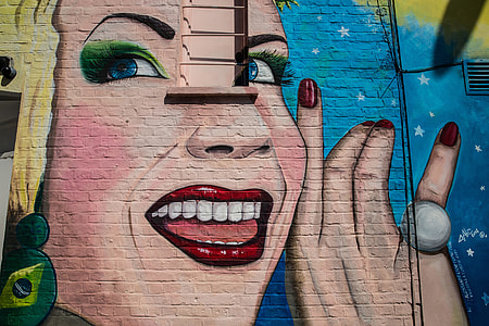 Street art depicting a woman smiling captured on a wall in Camden, Central London. Image taken with a Canon 6D thumbnail