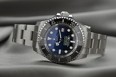 gray Rolex watch reading at 10:12 thumbnail