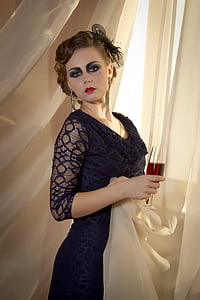 woman wearing black lace floral elbow-sleeved scoop-neck dress with black facinator thumbnail