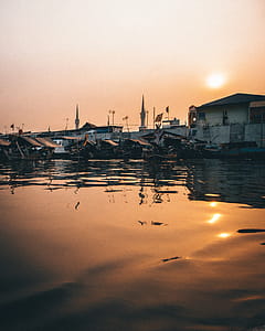 Boats Moored on Body of Water thumbnail