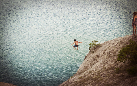 man jumped on cliff to water thumbnail