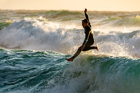 man jumping on waves thumbnail