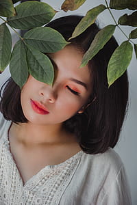 Woman Wearing Beige V-neck Shirt Under Tree thumbnail