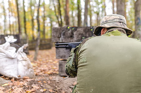 Man Holding Rifle thumbnail