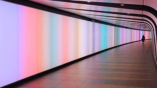 woman walking along a hall thumbnail