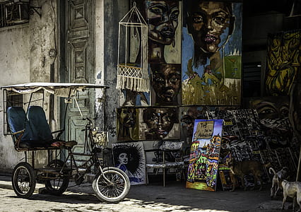 black bicycle near paintings thumbnail