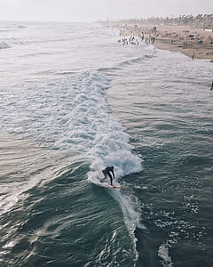 man surfing on ocean waves thumbnail