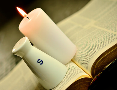 white pillar cable and salt shaker on opened book thumbnail