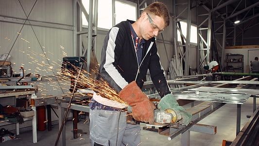 man welding metal frame during daytime thumbnail