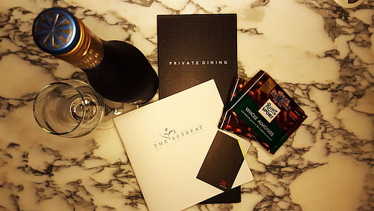 flat-lay photography of wine bottle and and wine glass thumbnail