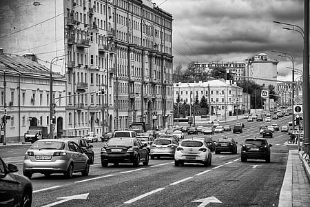 grayscale photography of moving vehicles on road thumbnail