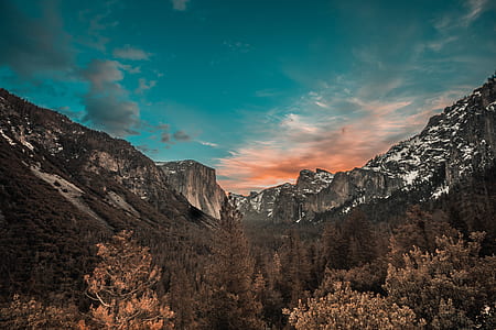 mountains under blue sky during daytime thumbnail