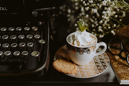 Coffee in a decorative cup with a golden ornament thumbnail