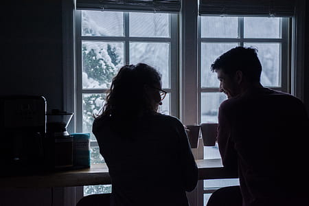 man and woman sitting on chairs thumbnail