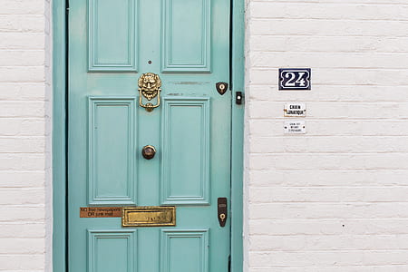 closed teal wooden 6-panel door thumbnail
