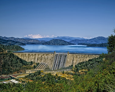bird's-eye view photography of water dam near trees thumbnail