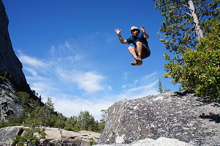 man jumping on rock thumbnail