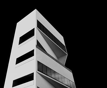 low-angle photography of white concrete building thumbnail