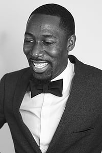 man wearing black peaked lapel suit jacket thumbnail
