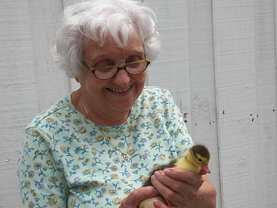 woman holding yellow duck thumbnail