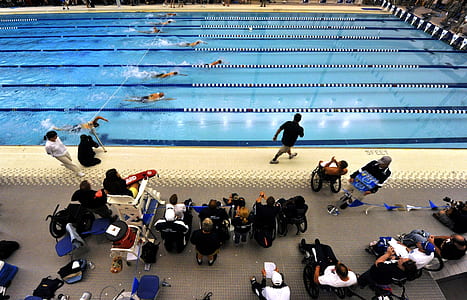 swimmers racing in swimming pool thumbnail