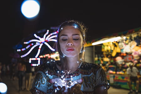 woman holding minilights thumbnail