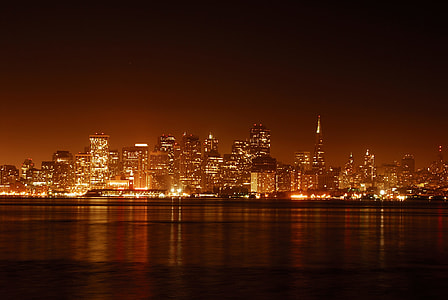 photo of building in city during night time thumbnail