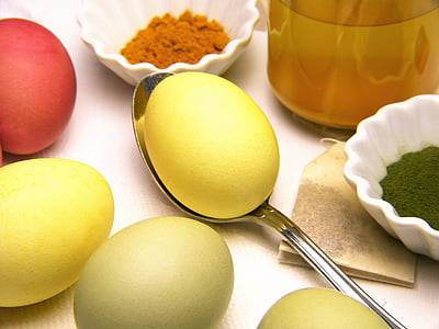 yellow egg on top of stainless steel spoon thumbnail