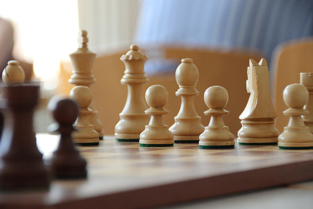 white and brown wooden chess toy thumbnail