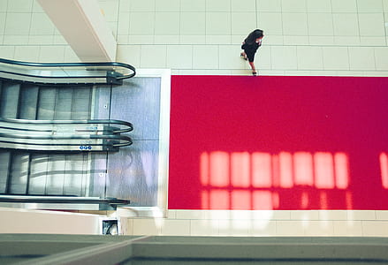 woman walking near escalator thumbnail