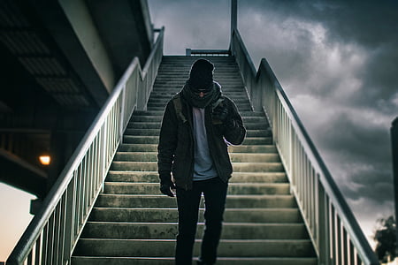 man standing in middle of stair case thumbnail