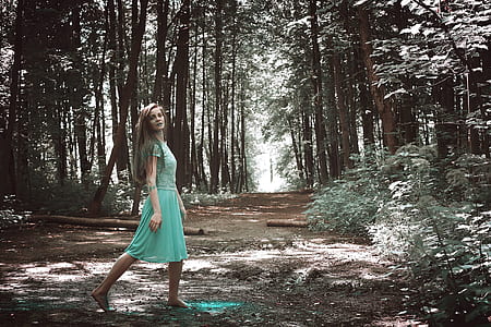 woman in teal dress in the woods thumbnail