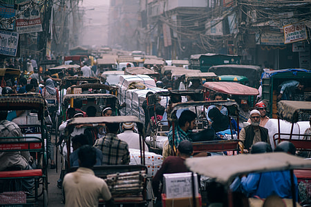 people riding auto rickshaws during daytime thumbnail