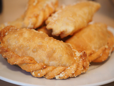 baked empanada served on white plate thumbnail