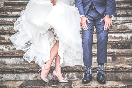 bridge and groom sitting on stairs thumbnail