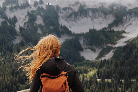 woman on top of mountain thumbnail