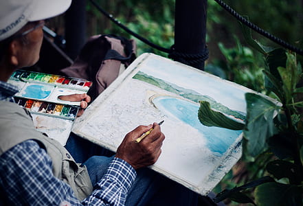 person painting seashore thumbnail