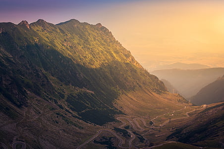 aerial view of road beside mountain thumbnail