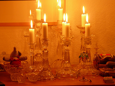 lit white candles thumbnail