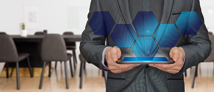 person holding silver tablet thumbnail