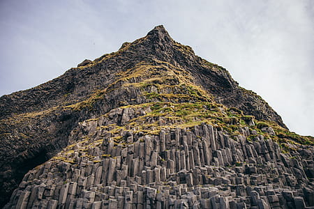 Basalt columns in Iceland with layered rock formations thumbnail
