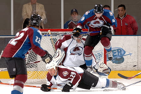 three ice hockey players on field thumbnail