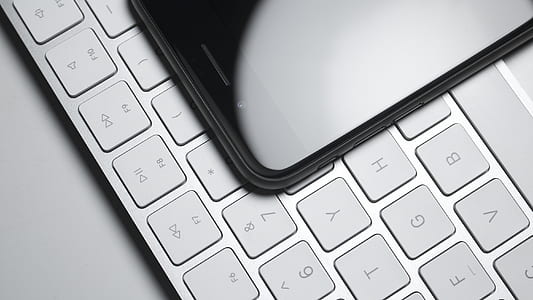 closeup photo of black smartphone on keyboard thumbnail