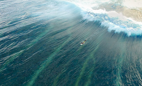 person surfing on wave thumbnail