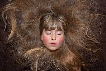 woman with brown hair eyes closed thumbnail