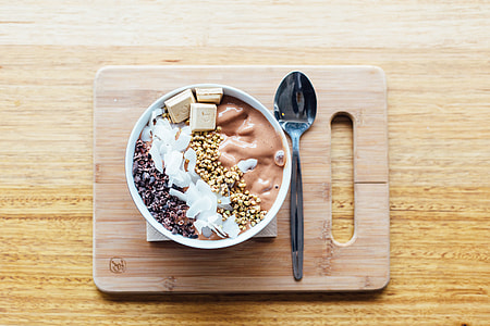 round white bowl near gray metal spoon thumbnail