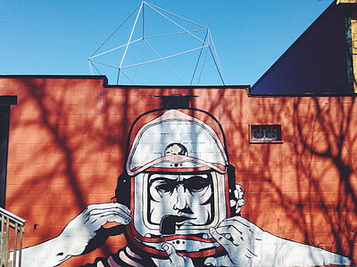 man wearing white and red helmet wall paint thumbnail