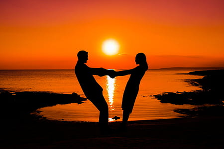 silhouette man and woman holding each other thumbnail